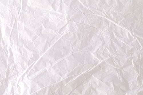 Preview: Crumpled white wrapping paper creates textured background