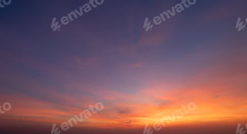 Preview: Sunset sky. Abstract nature background. Dramatic blue and orange, colorful clouds at twilight time.