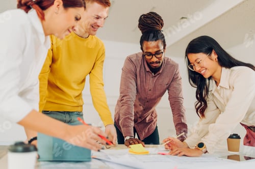 Preview: Arabic man having a meeting in an office with other diverse architects