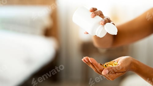 Preview: Unrecognizable Black Female Pouring Out Vitamin Food Supplement Capsules Out Of Bottle