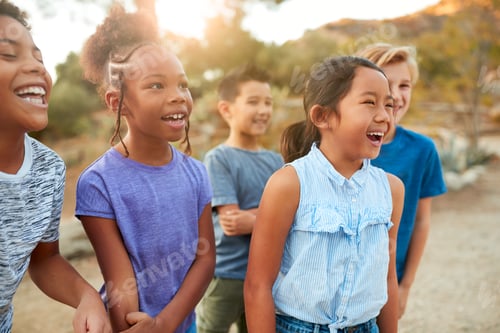 Preview: Group Of Multi-Cultural Children Posing And Hanging Out With Friends In Countryside Together