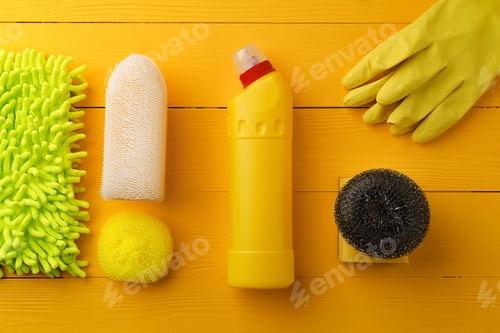 Preview: Cleaning tools composition flat lay on yellow wooden background