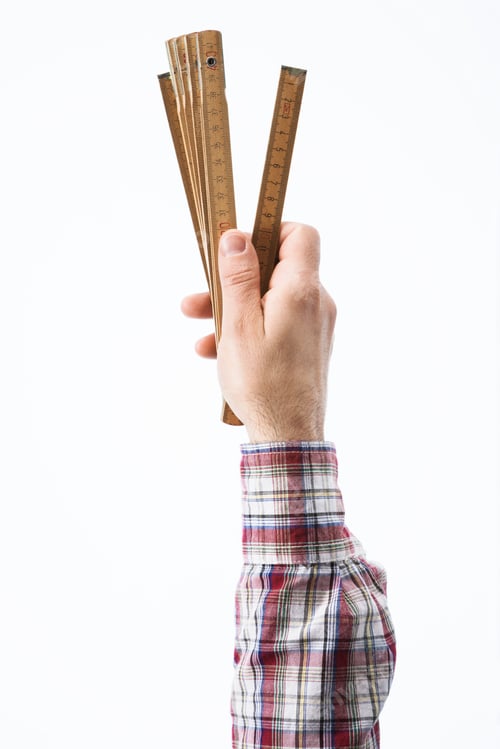 Preview: Hand holding a folding ruler
