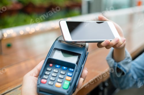 Preview: Woman use of mobile phone to pay