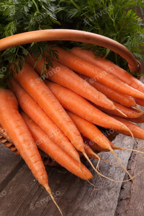Preview: Fresh Carrots in a Basket on Rustic Wood