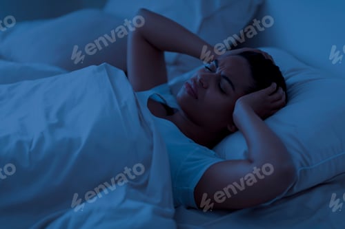 Preview: Sleepless Black Woman Lying In Bed And Touching Her Head