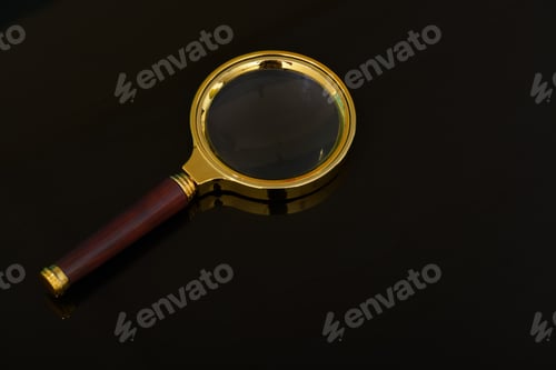 Preview: Magnifying glass isolated on a black background.