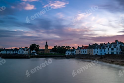 Preview: Dreel Halls church surrounded by buildings in Scotland during sunset