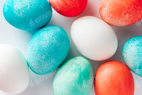 Preview: Multi-colored Easter eggs close-up on a white background.