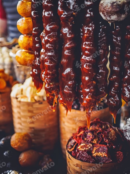 Preview: alani and churchkhela hanging on market at armenia