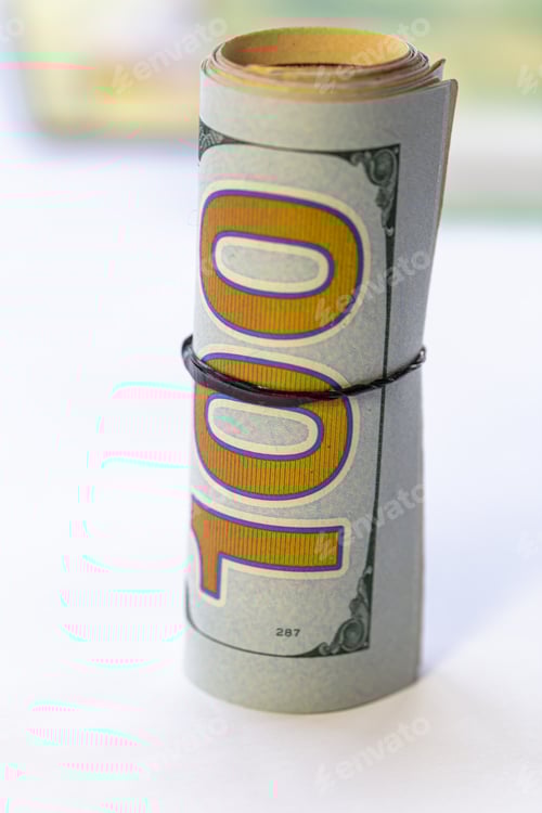 Preview: Roll of one hundred dollar bills with band