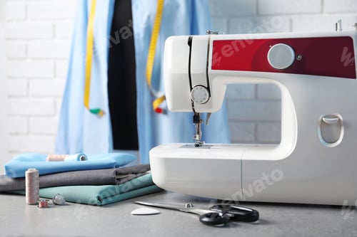 Preview: Sewing machine, fabrics and accessories for tailoring on table