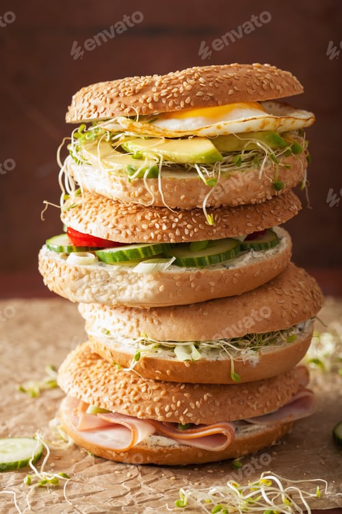 Preview: variety of sandwiches on bagels: egg, avocado, ham, tomato, soft