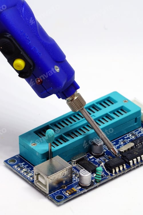 Preview: Closeup of soldering on printed circuit board isolated in white background