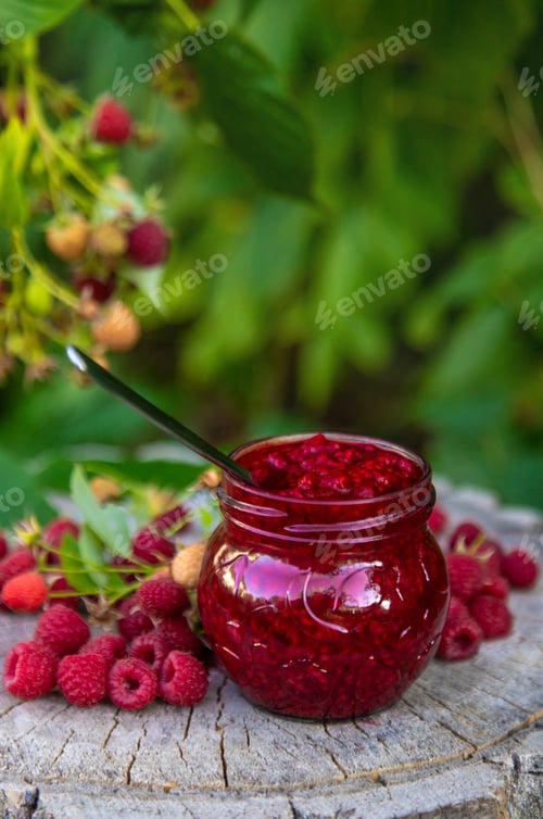 Preview: Raspberry jam in the garden. Selective focus.