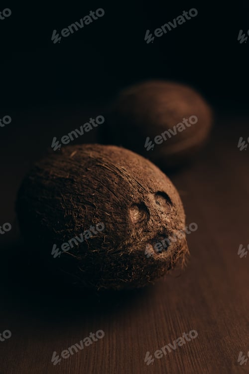Pair of Coconuts on a Wood Surface