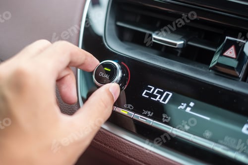 Preview: man hand adjusting temperature the air flowing during driving car on the road, air conditioner cooli