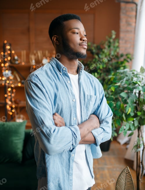 Preview: Black man with a cunning look in the living room