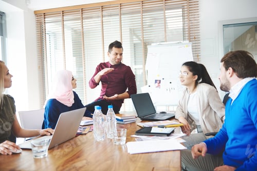 Preview: Business people using laptops over meeting
