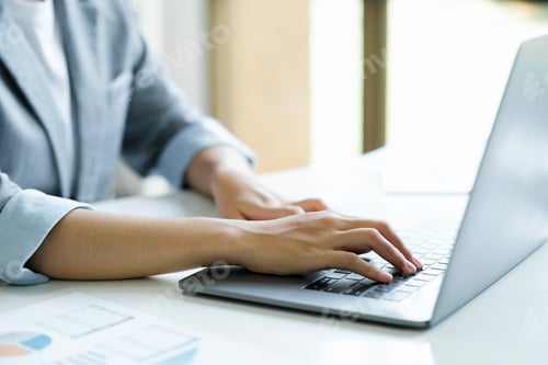 Preview: Close up of Businesswoman working at office using laptop.