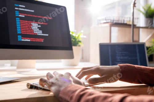 Preview: Hands of contemporary programmer over keypad during work over new software
