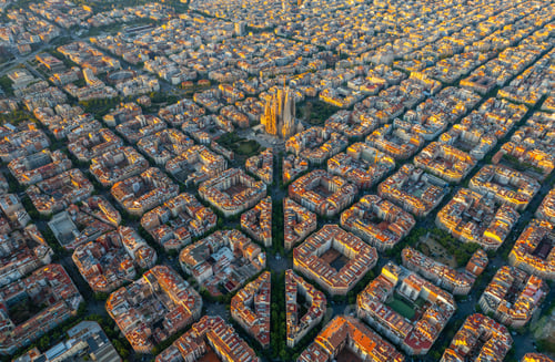 Preview: Aerial view of Barcelona Eixample residential district and Sagrada Familia Basilica at sunrise