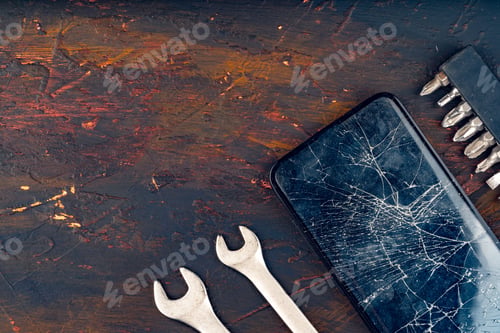 Preview: Mobile smartphone with broken screen close up