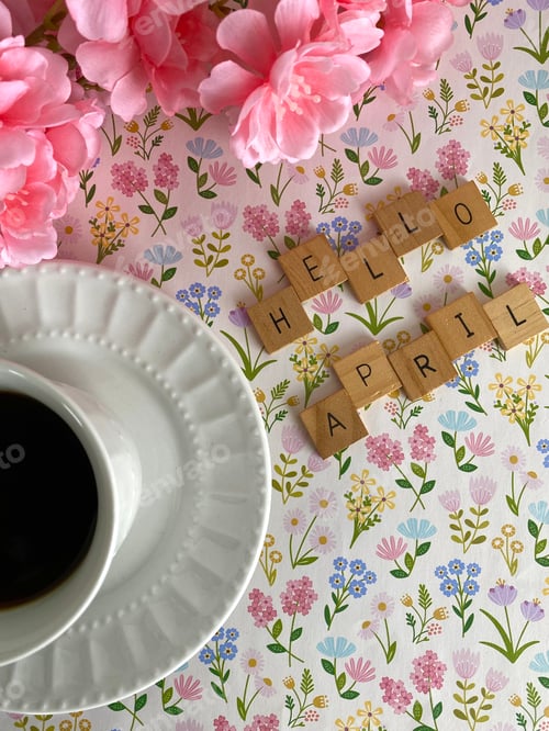Preview: HELLO APRIL on glowered background with flowers and coffee