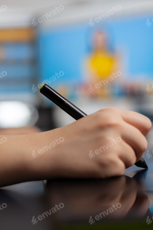 Preview: Close up of color woman retoucher holding stylus pencil moving on graphic tablet