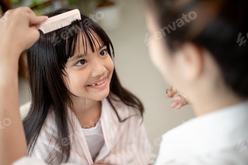 Preview: Young Girl Gets Hair Combed Indoors