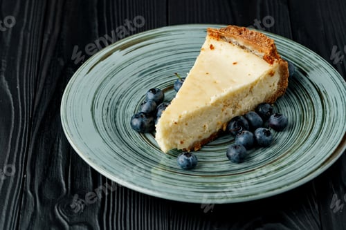 Preview: Piece of classic cheesecake on green plate