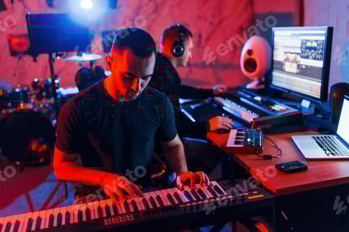 Preview: Sound engineer have recording session with piano player indoors in the studio