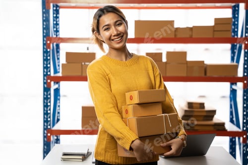 Preview: female entrepreneurs check online orders to prepare to pack the boxes, sell to customers