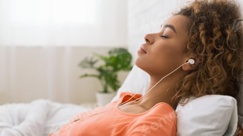 Preview: African-american woman listening calm music and relaxing