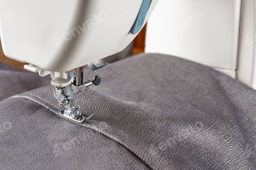 Preview: Modern Sewing Machine With Gray Velours Fabric Close Up