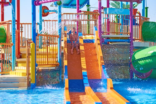 Preview: Colorful slides in the waterpark close up. Aquapark sliders with pool