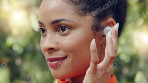 Preview: Brazilian woman, earphones and music in fitness workout, forest background training and nature park