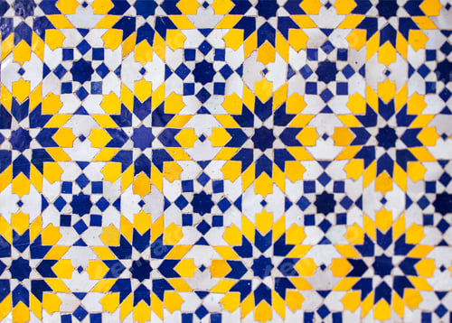 Preview: Colorful geometric tile pattern featuring blue, yellow, and white hues