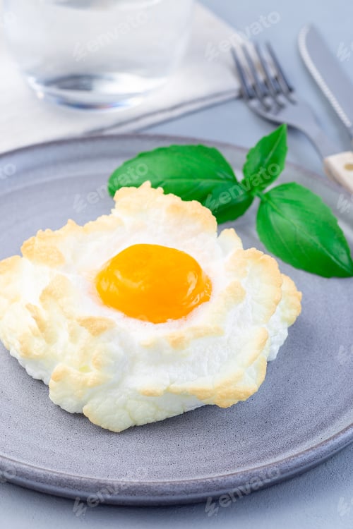 Preview: Oven baked cloud or fluffy egg dish on gray plate, vertical