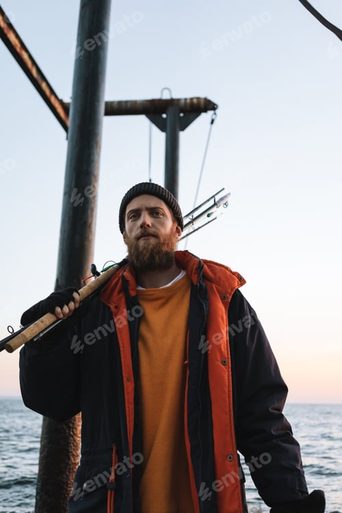 Preview: Handsome brutal bearded fisherman wearing coat