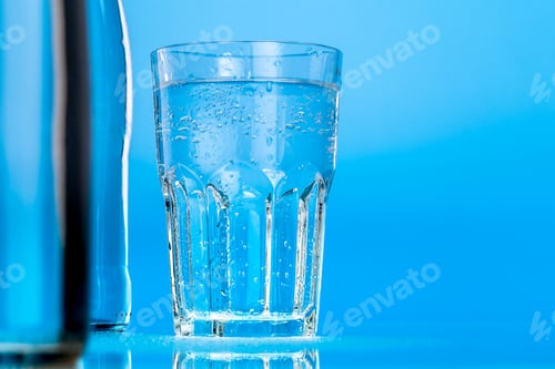 Preview: glass of water on a blue background