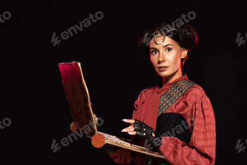 Preview: attractive steampunk woman using laptop isolated on black