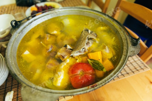Preview: Fish soup boils in a cauldron, picnic in nature