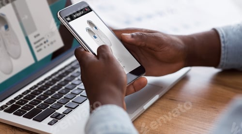Preview: Black Man Shopping Online With Smartphone And Laptop Indoors, Cropped