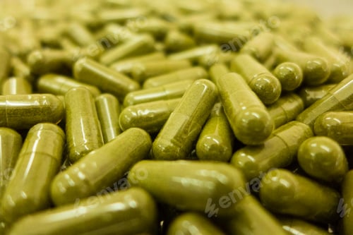 Preview: Closeup shot of medical pills in the production line