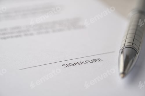Preview: close up of signature on a contact on table