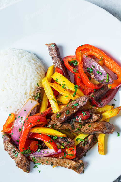 Preview: Lomo saltado - fried pieces of beef with peppers, onions and potatoes