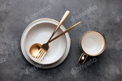 Preview: Stylish empty dishware and cutlery on grey table, flat lay