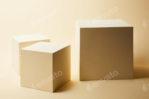 Preview: still life of cubes in different sizes on beige surface