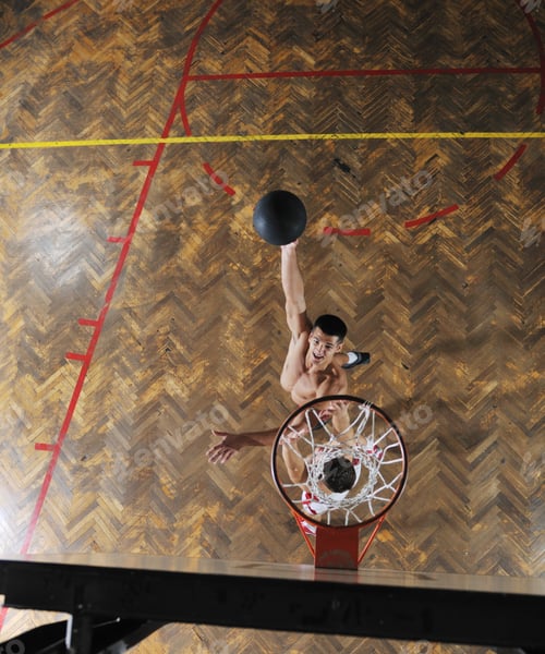 Athletic Man About To Dunk a Basketball